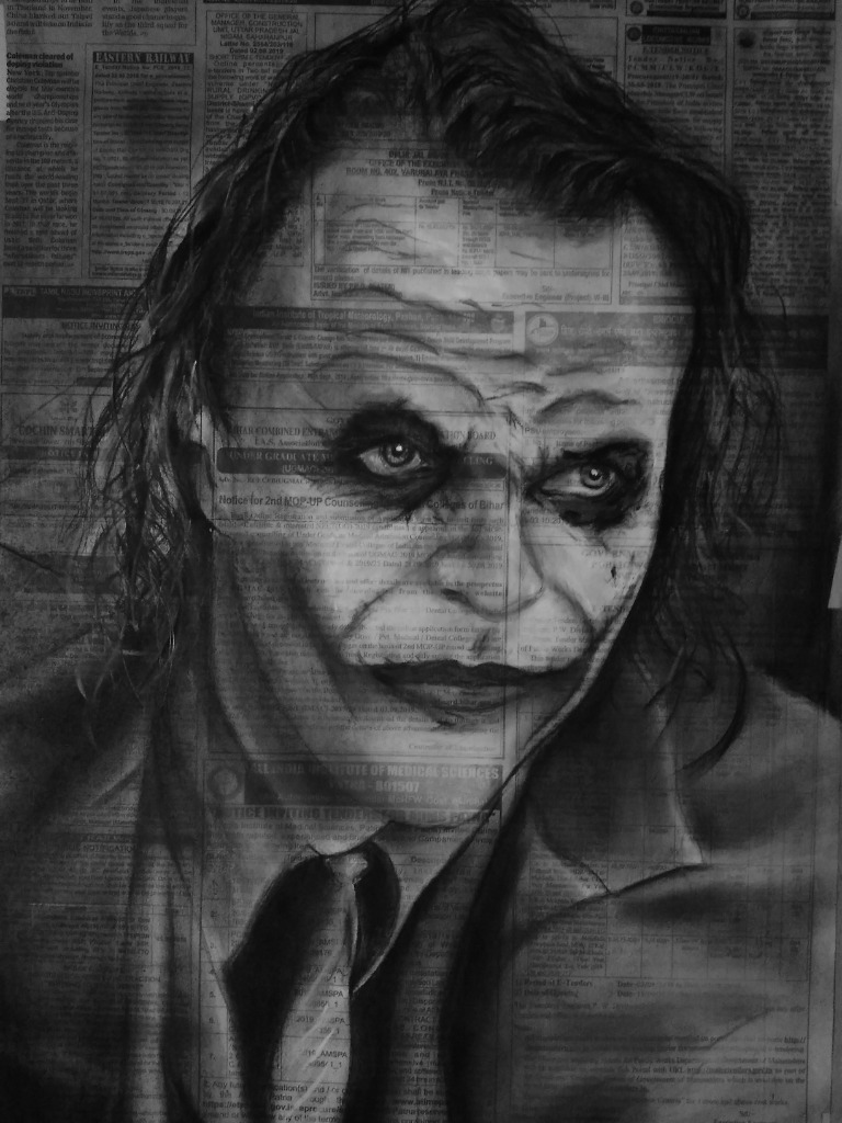 Charcoal sketch of Joker on newspaper by Deepak