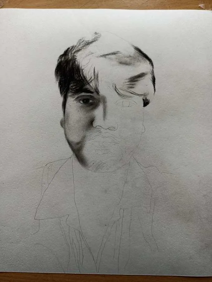 Charcoal portrait creation process in the art studio