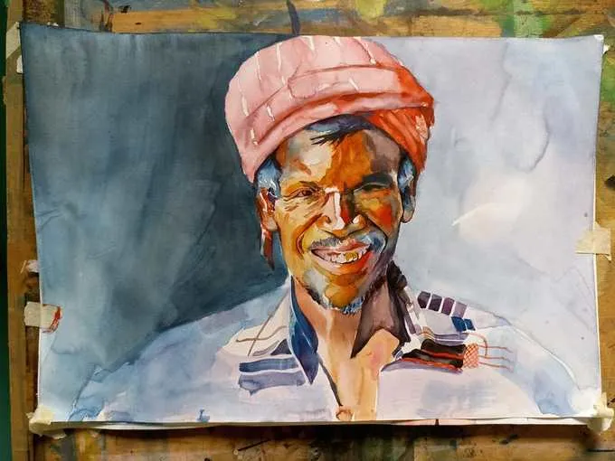 Vibrant watercolor portrait of a man wearing a pink turban